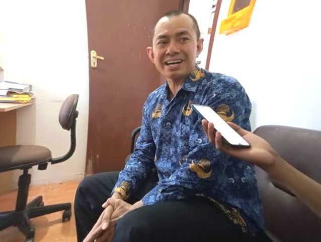 Camat Kota Bangun Darat, Julkifli terkait pembangunan jalan di Desa Kedang Ipil. (Foto/ist)